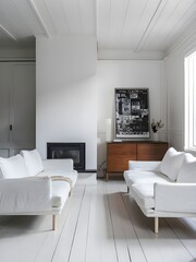 Dual white couches next to fireplace on white wall with wooden cabinet and art print. Simplistic Scandinavian-style living room interior.