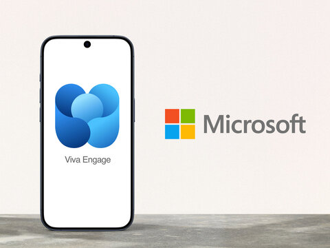 Viva Engage Logo is displayed on a modern smartphone, Microsoft logo next to it, enterprise social networking service that is part of the Microsoft 365 family of products, Microsoft, Yammer