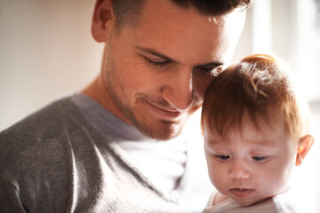 Peace, love or father and baby in a house with care, trust and child development, support or bonding. Family, security and dad with kid at home for learning, safety or morning games with gratitude