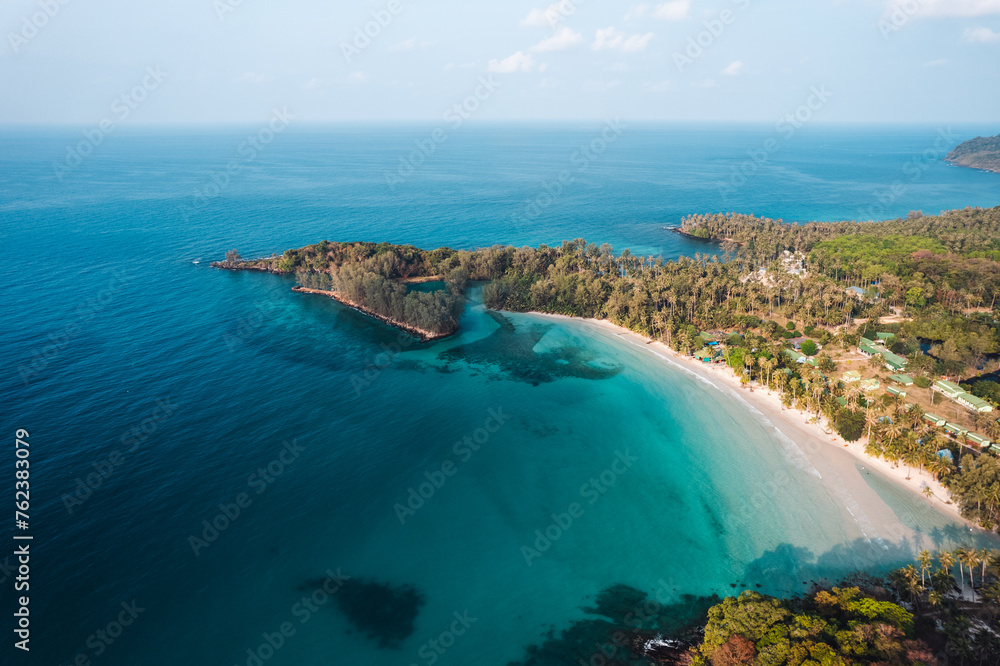 Wall mural aerial beach and coconut trees on a calm island in the morning