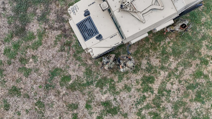 Army soldier shooting with firearm in battlefield. United States Army ranger during the military...