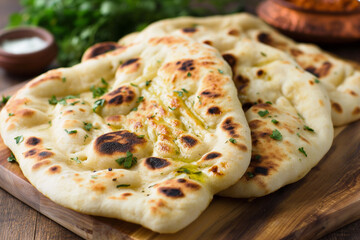 
The most widely accepted Indian bread is the spongy naan bread. This unleavened bread can be baked or fried. and often appears in conjunction with Indian restaurants - obrazy, fototapety, plakaty