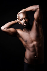 Fototapeta na wymiar Black man, fitness and body muscle in studio for sports, workout or exercise isolated on dark background. Strong, abs and topless African person with eyes closed for health or wellness of bodybuilder