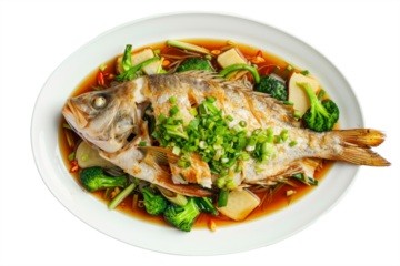 Chinese style fish dish: whole fish steamed with ginger, green onions and soy sauce, served with steamed rice and vegetables on a white platter.