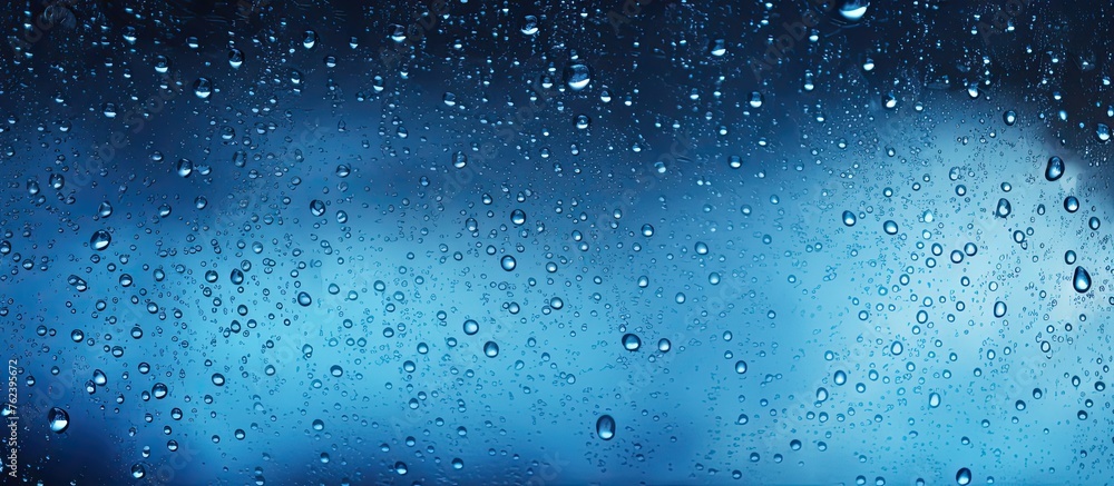 Sticker a close up of rain drops on a window captures the beauty of water in its liquid form. the electric b