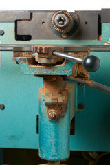 close-up of adjustment lever of old and used planing machine in woodworking workshop, carpentry or joinery industry concept, side view taken in selective focus with copy space