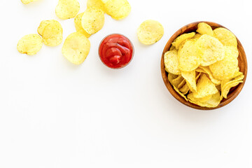 Oven backed low calorie potato chips. Snacks background, top view