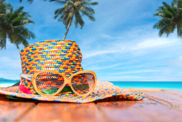 Straw hat on the beach with sea and sky on island background, Summer vacation concept 