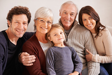 Grandparents, parents and child on couch for portrait with hug, care or love with generations for...