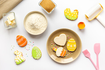 Easter baking with homemade cookies - eggs and bunny. Cooking flat lay