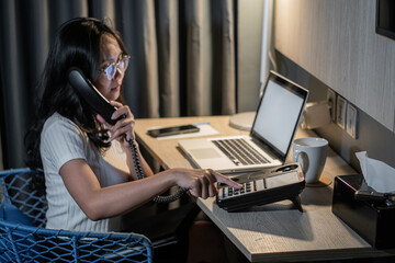 Asian girl response answer customer or partner in operation room for business and technology concept.