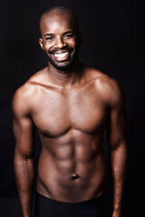 Black man, shirtless and body with smile in portrait, fitness and health with muscle or abs on dark...