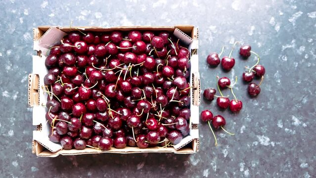Video wallpaper of cherries in a wood box picked in the town of San Climent, Barcelona, Spain