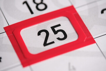 Calendar date. The 25th number the calendar is highlighted in a red frame.