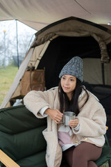 Woman enjoy her winter time camping - 762413281
