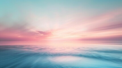 Obraz premium A serene seascape merges with the dawn sky, displaying a gentle interplay of soft pink and blue hues reflecting on calm waters.
