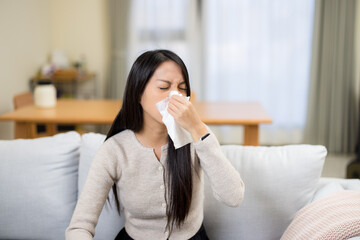 Woman flu and sneeze at home - 762414086