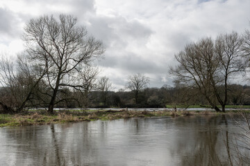 view of the River Avon at Salisbury Wiltshire England after it has burst its banks and flooded...