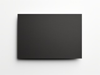 A hand holding a black paper isolated on white background
