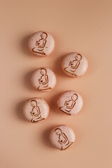 Colorful french dessert macarons with fresh fruits and nuts.