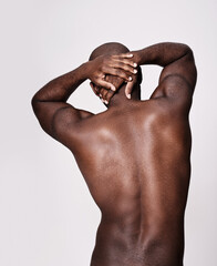 Back, stretching and man on a white background with body health, pain or fitness and exercise in...