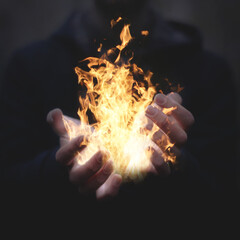 Hands holding fire