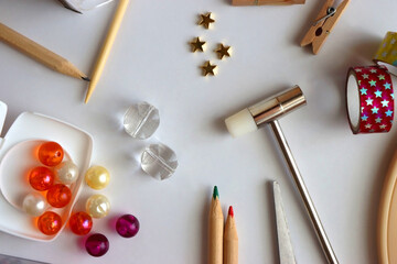 Various craft supplies on white background. Supplies for jewelry making, drawing and needlework....