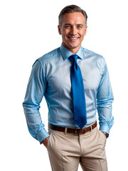 A man wearing a blue dress shirt and tie, smiling with his hands in his pockets.