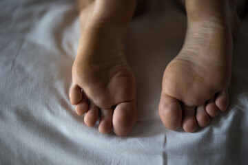 male legs on white pastel, male feet