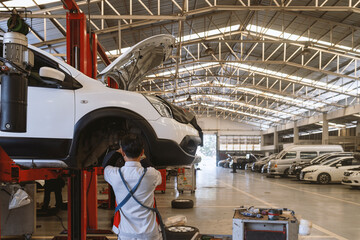 car repair in garage service station with soft-focus and over light in the background