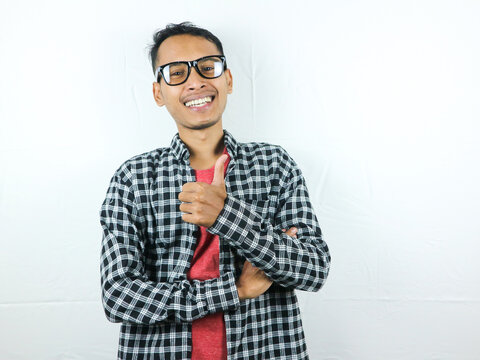 Asian man showing okay gesture isolated on white background. Agreement, approval. OK, Thumps up