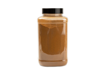 Cinnamon powder in a jar isolated on a white background. Spicy spice for baking and drinks. Fragrant ground cinnamon.