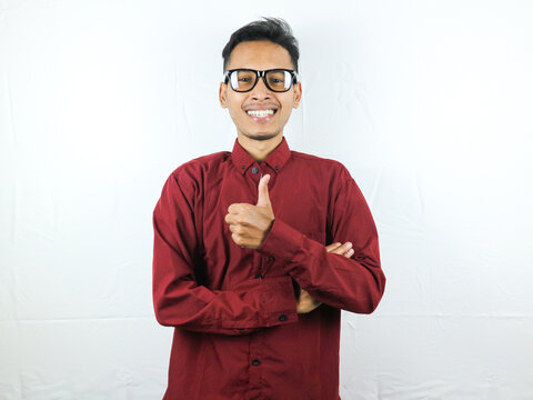 Asian man showing okay gesture isolated on white background. Agreement, approval. OK, Thumps up