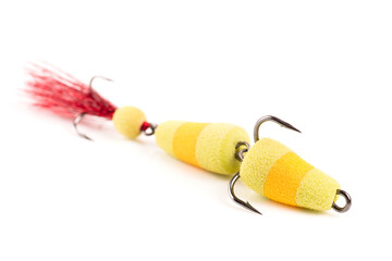 Polyurethane fishing bait with treble hooks for pike and zander shot on white background