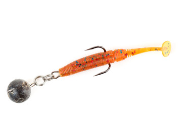 Orange fishing lure, plastic shad fish, with double hook and lead sinker, isolated on white