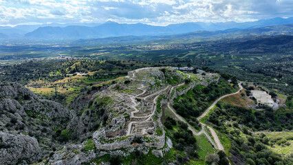 Fototapeta na wymiar Aerial drone scenic photo of uphill iconic archaeological site of Ancient citadel of Mycenae famous for round tomb of Agamemnon and Lion Gate, Argolida, Peloponnese, Greece