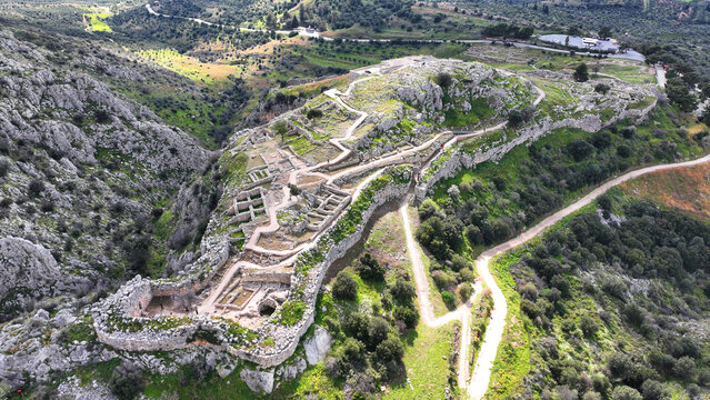 Aerial drone scenic photo of uphill iconic archaeological site of Ancient citadel of Mycenae famous for round tomb of Agamemnon and Lion Gate, Argolida, Peloponnese, Greece