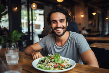 Fototapeta na wymiar Generated with AI picture of handsome cheerful man in cafe eating tasty vegetables salad