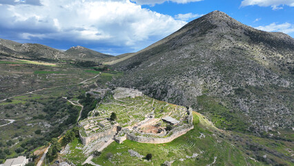 Aerial drone scenic photo of uphill iconic archaeological site of Ancient citadel of Mycenae famous for round tomb of Agamemnon and Lion Gate, Argolida, Peloponnese, Greece