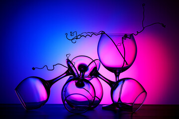 Still life with glass objects on a multicolored background