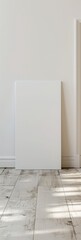 blank art canvas mockup on the laminate floor against the white wall