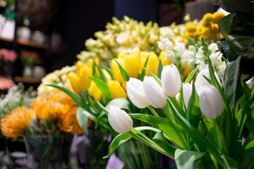 Yellow Tulips and other decorative flowers on the florist's counter