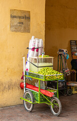 Cartagena, Colombia - July 25, 2023: Fresh lime juice pushcart closeup parked in passage of...