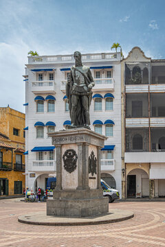 Cartagena, Colombia - July 25, 2023: Frontal closeup, Pedro de Heredia monument, bronze sculpture on stone pedestal on Plaza de los Coches in front of Writers Parliament building