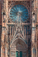 Detail of the central portal and rosette of the gothic facade of the cathedral of Strasbourg, France