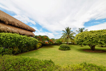 Scenic landscape with lawn and cloudy sky, shot with a wide-angle lens in the Dominican Republic