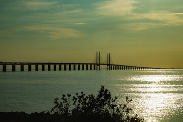Fototapeta na wymiar Oresund Bridge on sunset, between Sweden and Denmark, Malmo