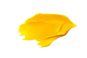 Closeup of clean yellow smear of medicine ointment on white surface
