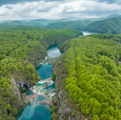 Amazing aerial view of Plitvice national park with lakes and picturesque waterfalls in a green spring forest, Croatia. - 762490848