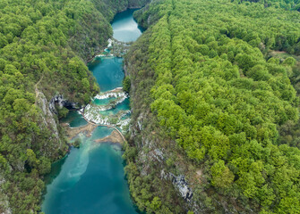 Amazing aerial view of Plitvice national park with lakes and picturesque waterfalls in a green spring forest, Croatia. - 762490876